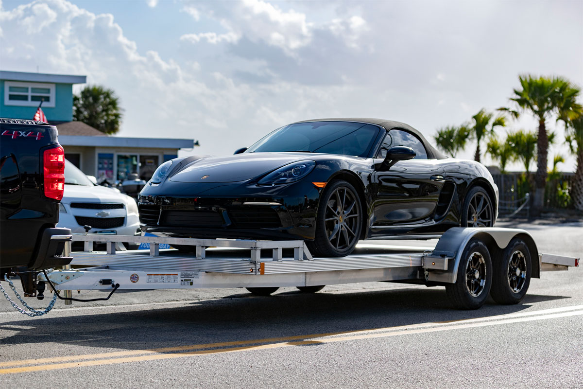 Black Car Loaded On CargoPro Open Car Hauler