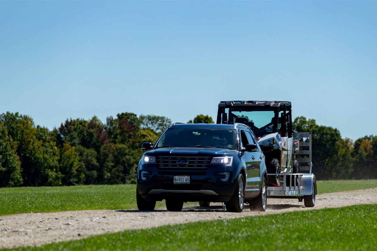 Ford Explorer Towing Utility RW 2.0 Trailer With ATV On Dirt Road