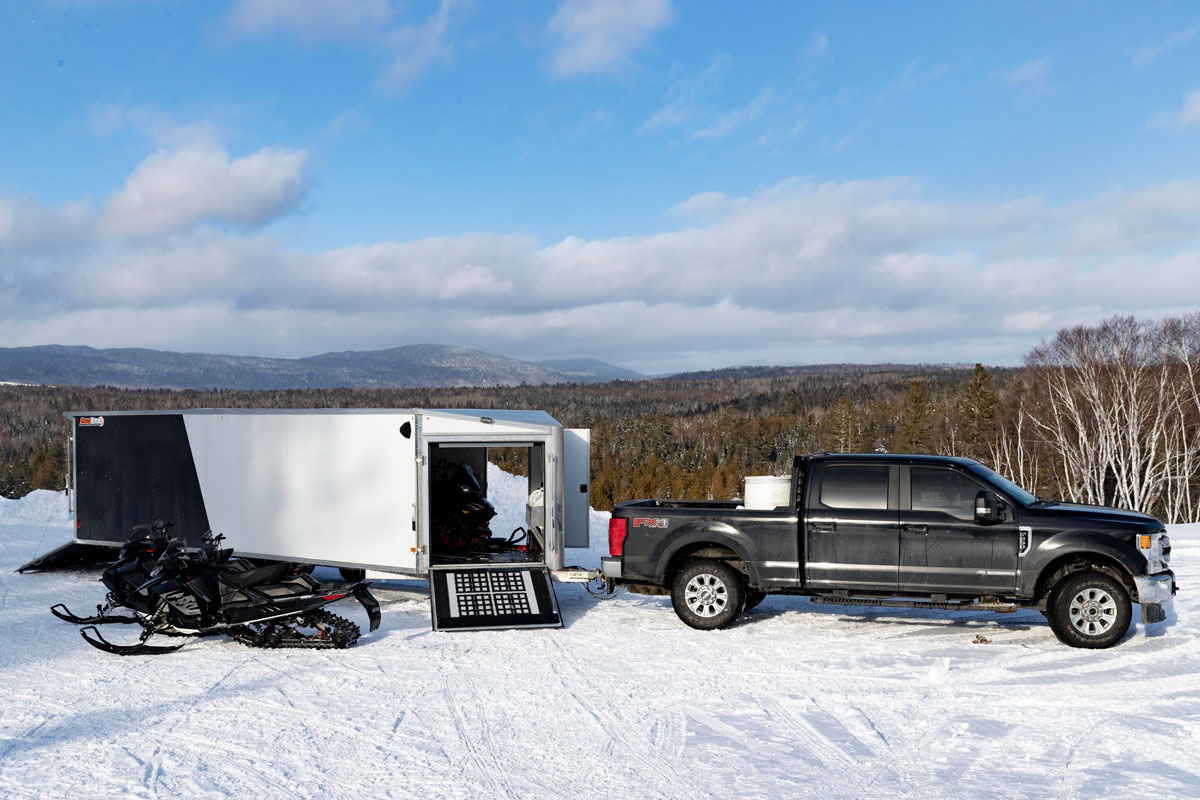 SnoPro Enclosed Deckover 6.5 Height Snow Trailers Rear and Front Doors Open With Snowmobiles